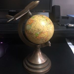 Decorative globe with airplane